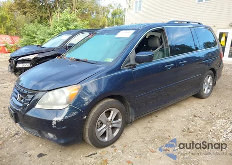 2010 Honda Odyssey Touring z USA, uszkodzony, nr VIN 5FNRL3H99AB058887